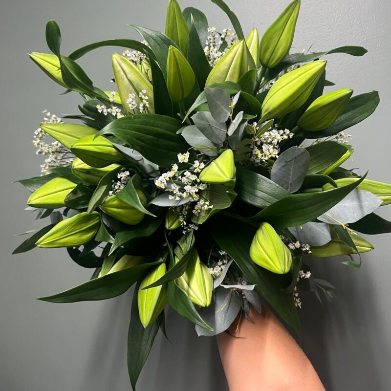 Classic, stylish and modern our Just Lilies Bouquet with mixed foliage is a standout arrangement in a gift bag of white. Order online for next day delivery.