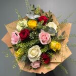 Bring a smile to someones face with this delightful bouquet Sent with Love Roses wrapped in natural paper. Order online for next day delivery.