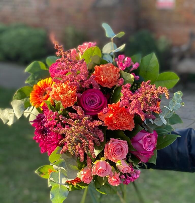 Sunset Bouquet - rich colours set this handtied off beautifully. The perfect gift. Order online for your next day flower delivery. Bishops Stortford