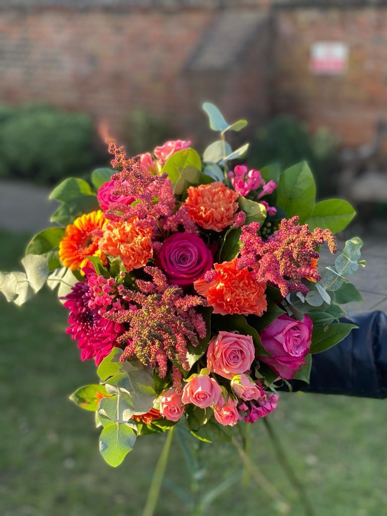 Sunset Bouquet - rich colours set this handtied off beautifully. The perfect gift. Order online for your next day flower delivery. Bishops Stortford