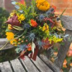 Bonfire Bouquet a handtied with autumnal warmth. Order online for your next day flower delivery. Bishops Stortford