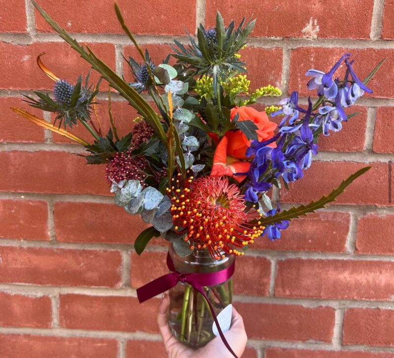 Florists Choice Jam Jar Vase Arrangement modern design using luxurious colours is the perfect gift. Order online for your next day flower delivery. Bishops Stortford