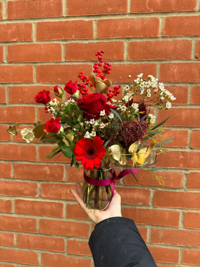 Festive Jam Jar Vase Arrangement packed full of Christmas goodies is the perfect gift. Order online for your next day flower delivery. Bishops Stortford