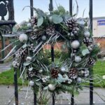 Frosty Christmas Wreath. A Christmas Door wreath full of wintery mix of foliages. Order online for your next day flower delivery. Bishops Stortford