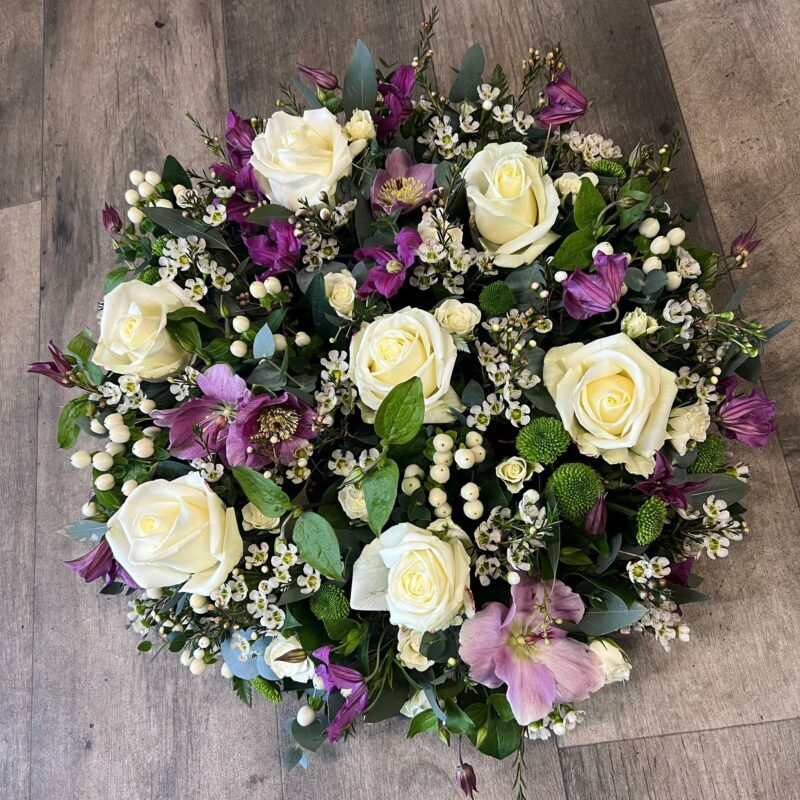 A traditional posy shape with loose flowers and seasonal foliage. Funeral Tribute. Order online with your personal choices. Bishops Stortford