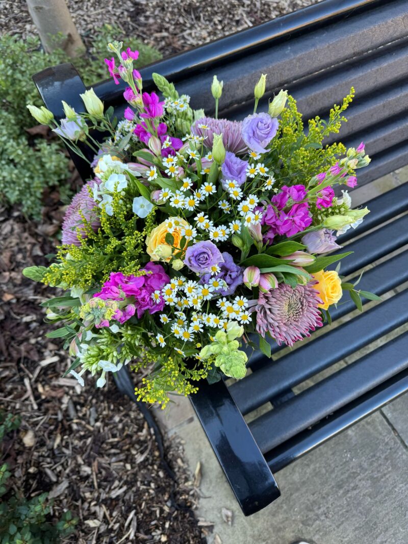 Buttercup Bouquet - a variety of flowers in pastel shades and lush foliage. Order online for your next day flower delivery. Bishops Stortford