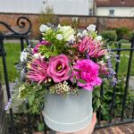 A modern floral design. Choose your colour palette. Handcrafted Hatbox. Order online for your next day flower delivery. Bishops Stortford