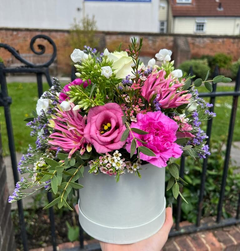A modern floral design. Choose your colour palette. Handcrafted Hatbox. Order online for your next day flower delivery. Bishops Stortford