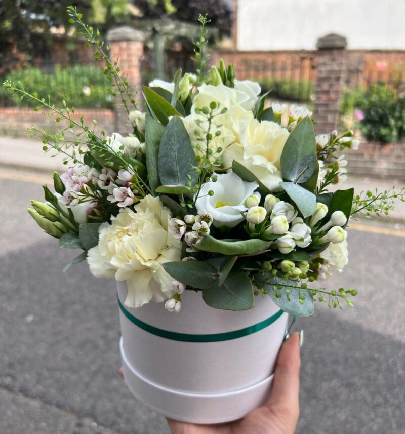 A modern floral design. Choose your colour palette. Handcrafted Hatbox. Order online for your next day flower delivery. Bishops Stortford