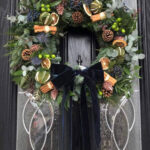 Blue Christmas Wreath. The deep blue velvet bow adds a touch of elegance. Order online for your next day flower delivery. Bishops Stortford