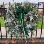 Frost Wreath a lush mix of greenery creating a wintry and festive look. Order online for your next day flower delivery. Bishops Stortford