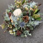 Home for Christmas Table Arrangement, a traditional circular arrangement. Order online for your next day flower delivery. Bishops Stortford