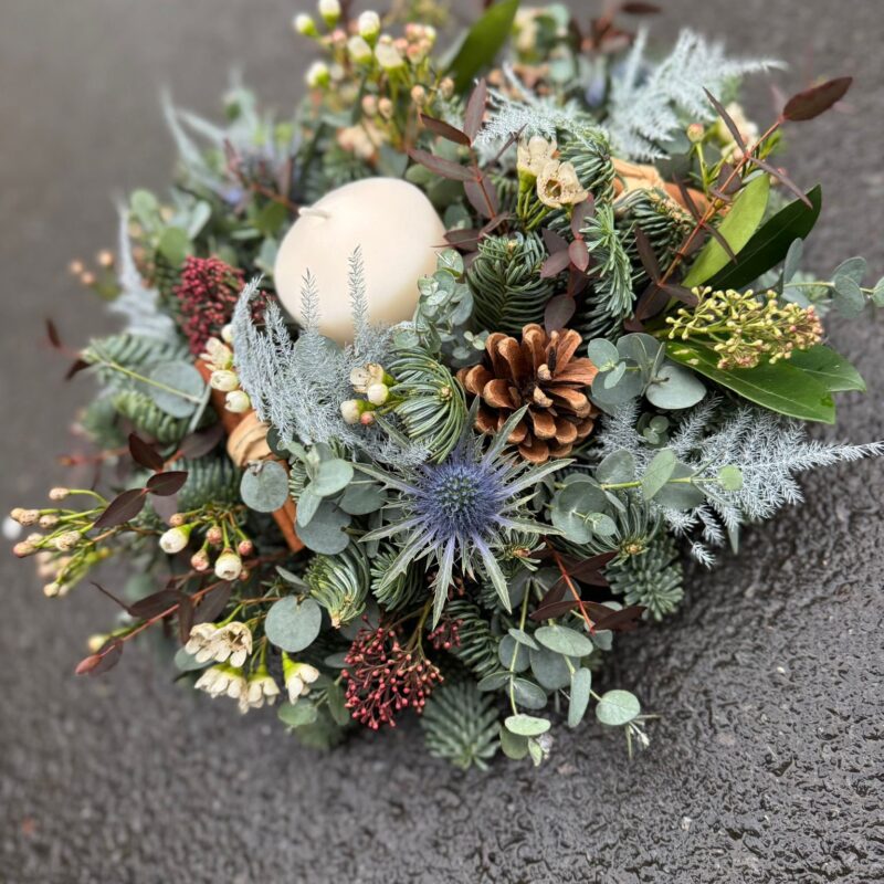 Home for Christmas Table Arrangement, a traditional circular arrangement. Order online for your next day flower delivery. Bishops Stortford