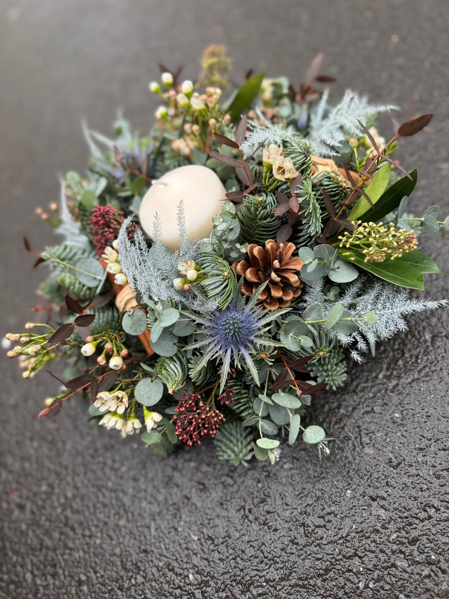 Home for Christmas Table Arrangement, a traditional circular arrangement. Order online for your next day flower delivery. Bishops Stortford