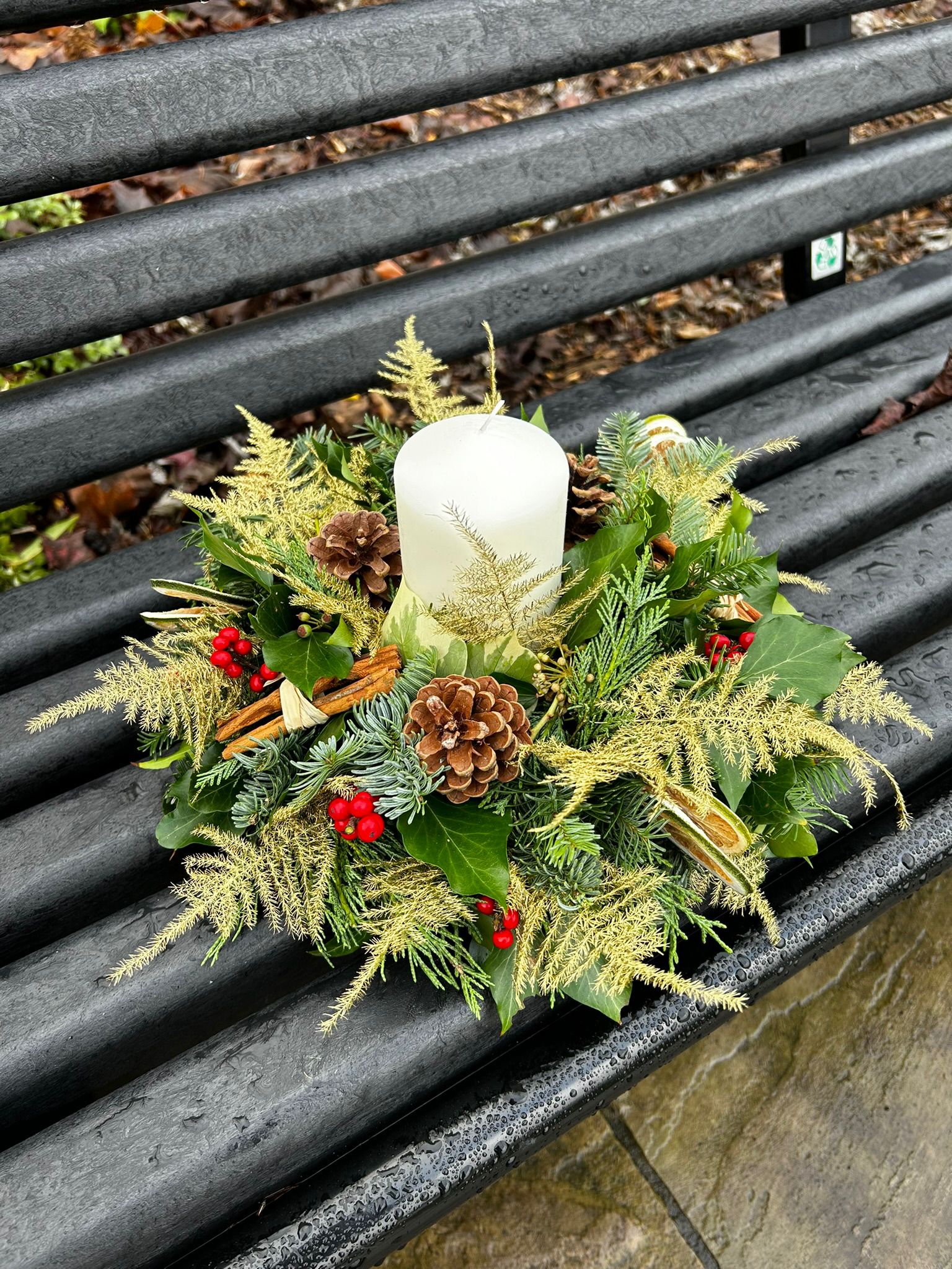 Home for Christmas Table Arrangement, a traditional circular arrangement. Order online for your next day flower delivery. Bishops Stortford