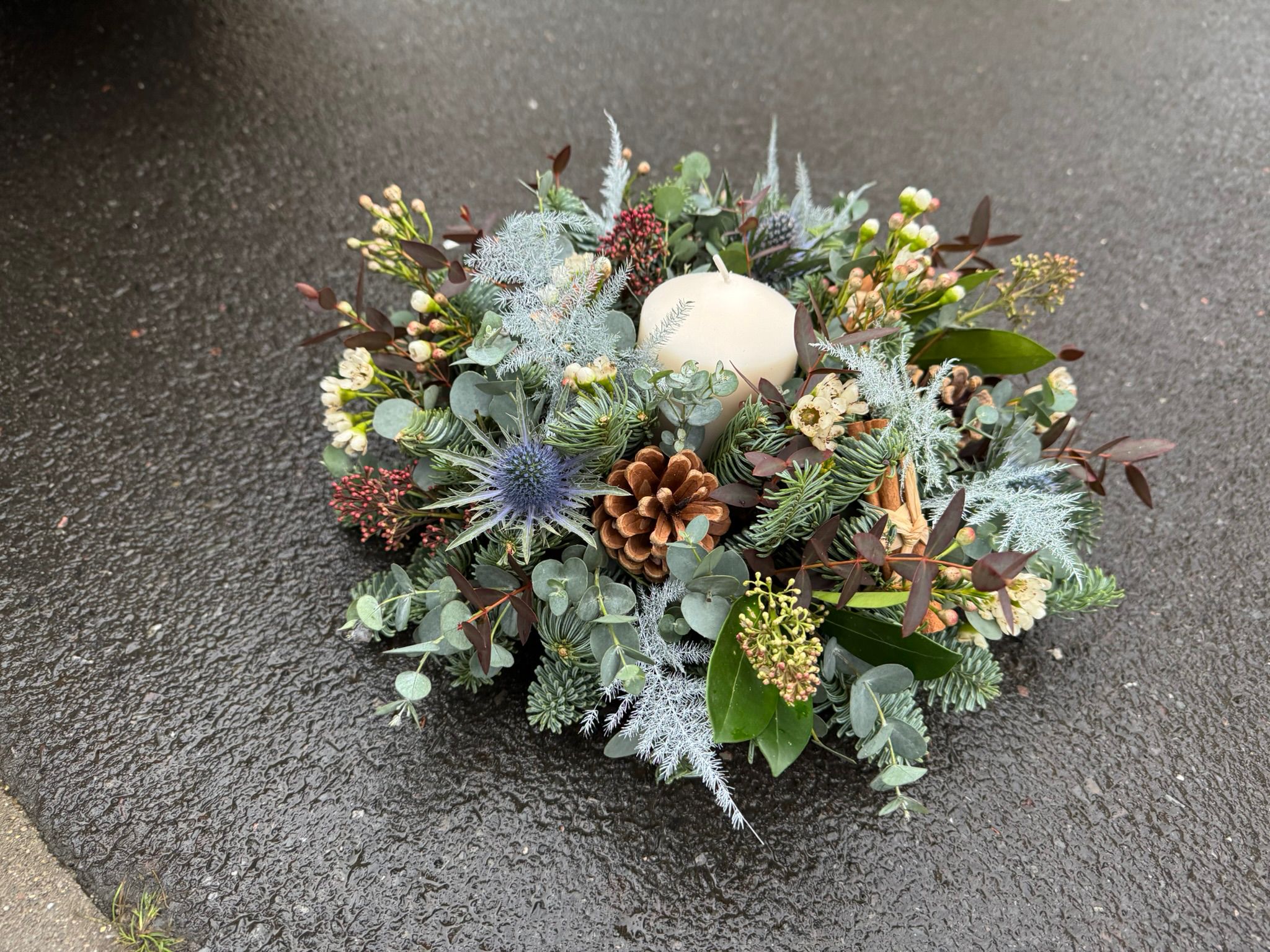 Home for Christmas Table Arrangement, a traditional circular arrangement. Order online for your next day flower delivery. Bishops Stortford
