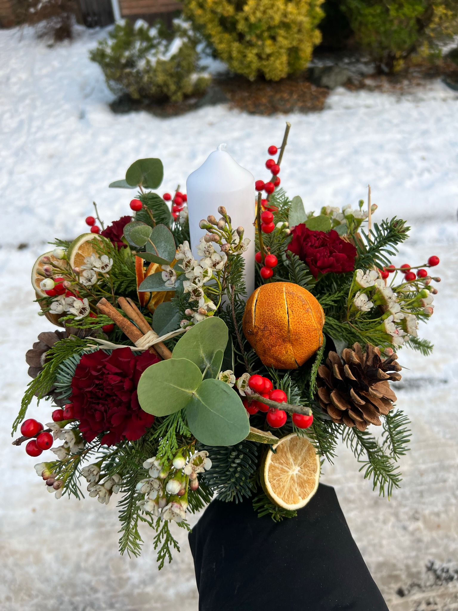 Home for Christmas Table Arrangement, a traditional circular arrangement. Order online for your next day flower delivery. Bishops Stortford