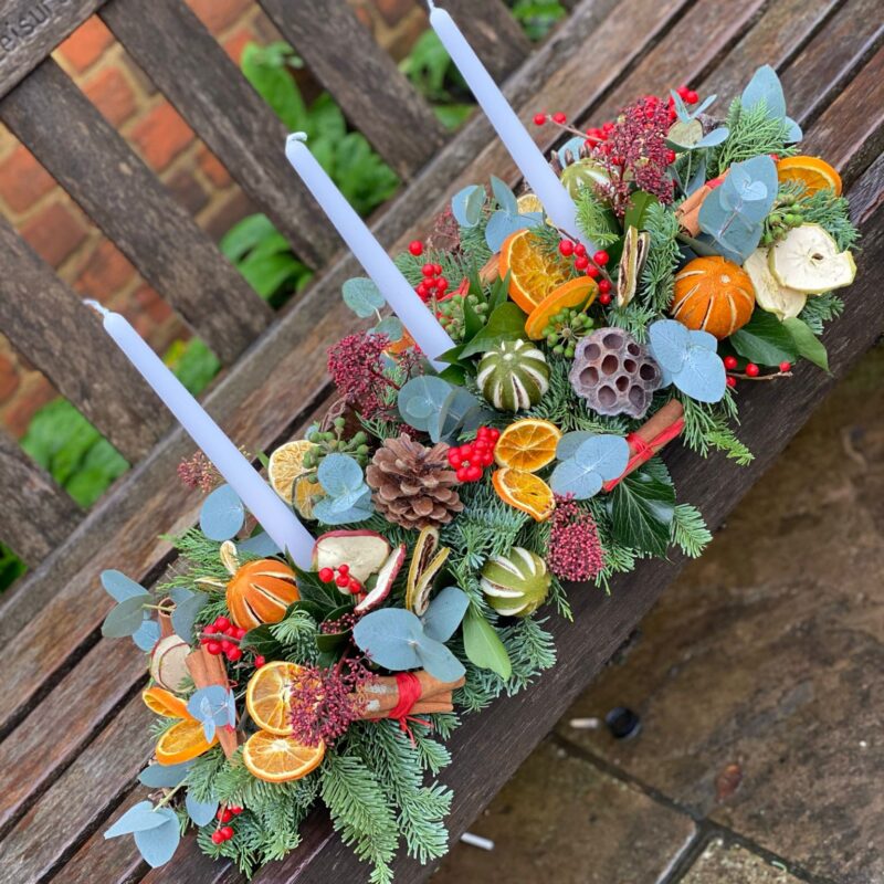 Noel Christmas Table Arrangement. A showstopper for your Christmas table. Order online for your next day flower delivery. Bishops Stortford