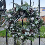 Snowman Wreath full of a wintery mixture of foliages. So much luxury! Order online for your next day flower delivery. Bishops Stortford
