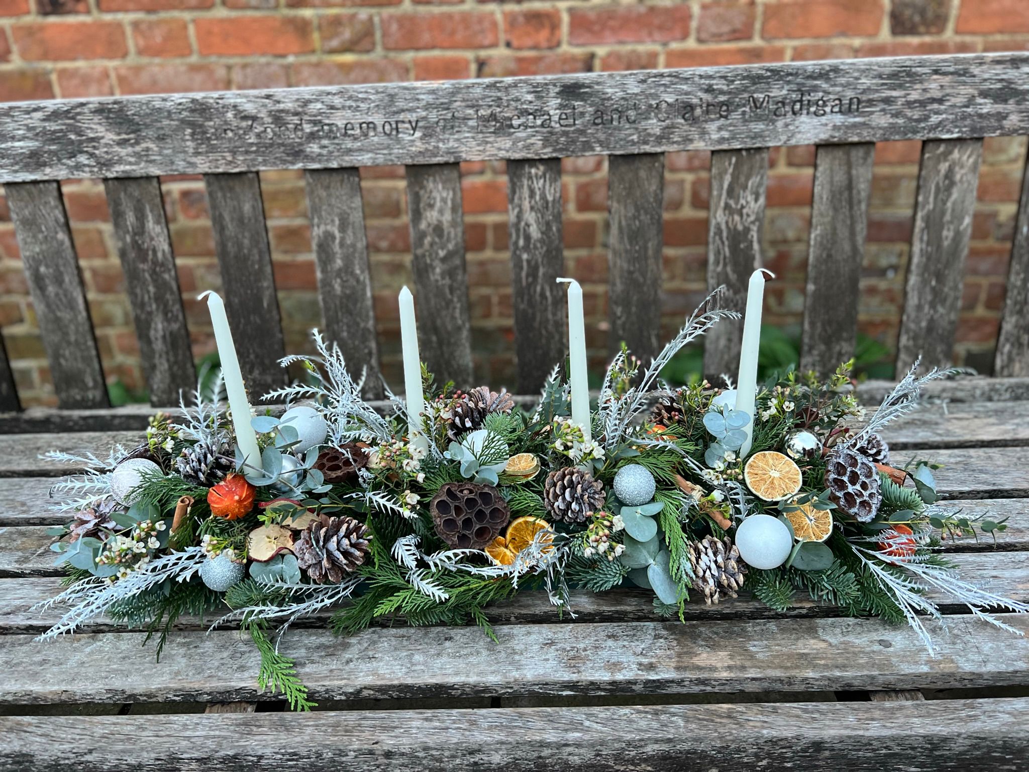 Noel Christmas Table Arrangement. A showstopper for your Christmas table. Order online for your next day flower delivery. Bishops Stortford