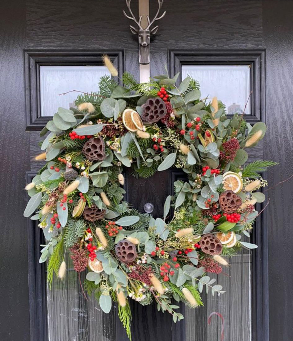 Winter Wonderland Wreath full of dried bunny ears, fruit and berries. Order online for your next day flower delivery. Bishops Stortford