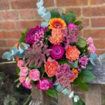 Sunset Bouquet. Rich colours of deep pink roses and bright orange gerbera. Order online for next day delivery or shop in store.