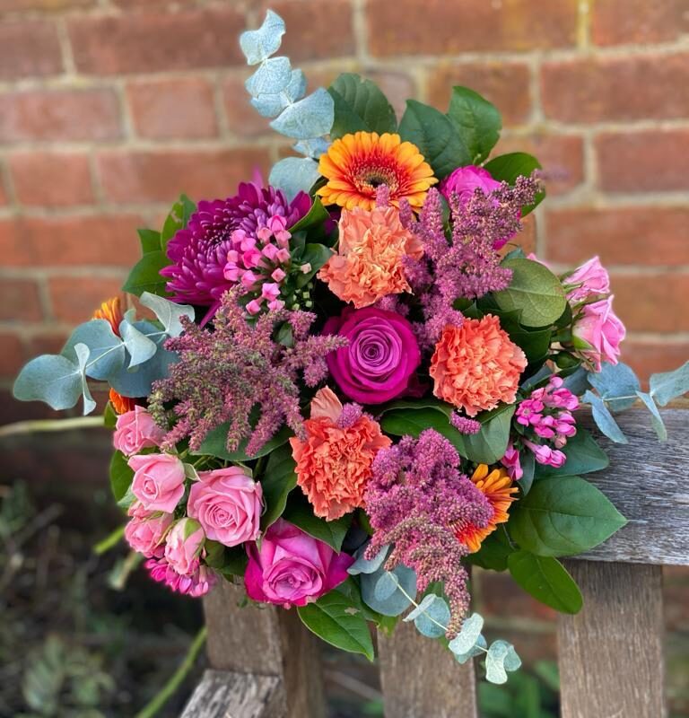 Sunset Bouquet. Rich colours of deep pink roses and bright orange gerbera. Order online for next day delivery or shop in store.